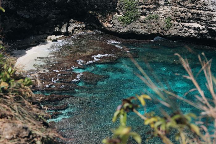 Clear turquoise water in a rocky cove