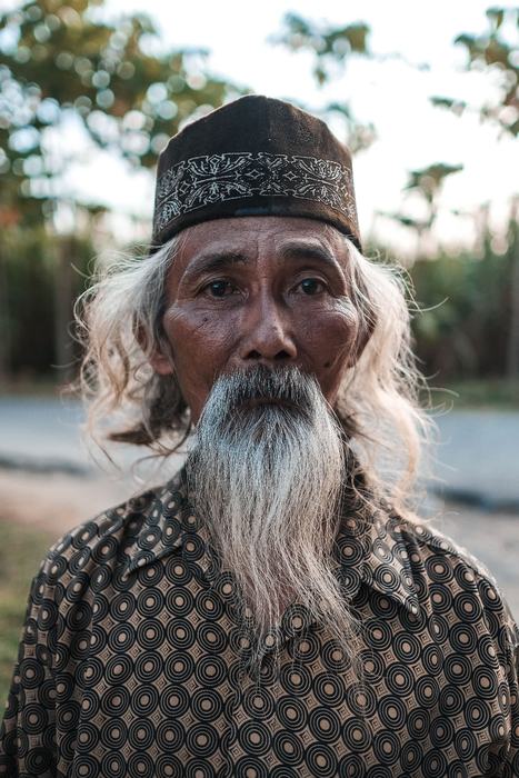 Portrait of a Balinese elder with a white beard