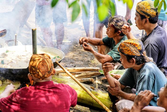 Villagers cooking over an open fire